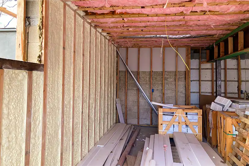 Wall cavities sealed with spray foam during a renovation