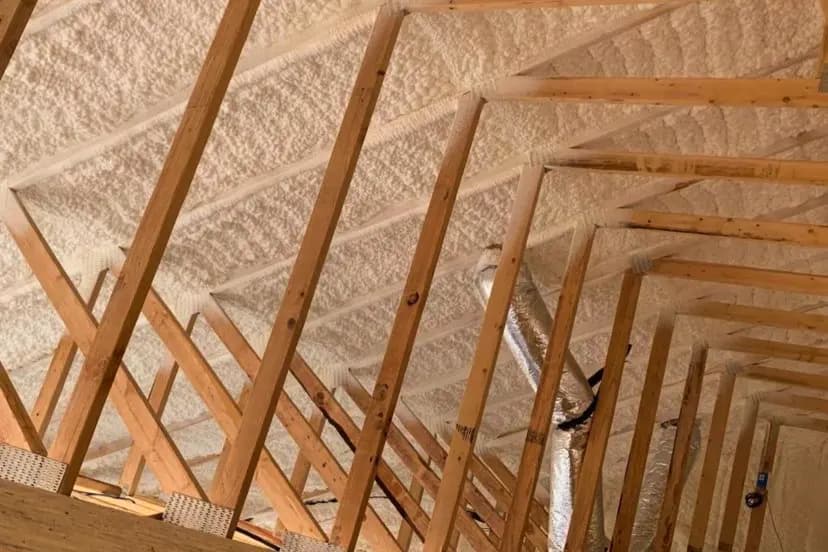Sebastian Spray Foam crew insulating a roof deck with spray foam between the rafters